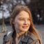 smiley-woman-outdoors-city